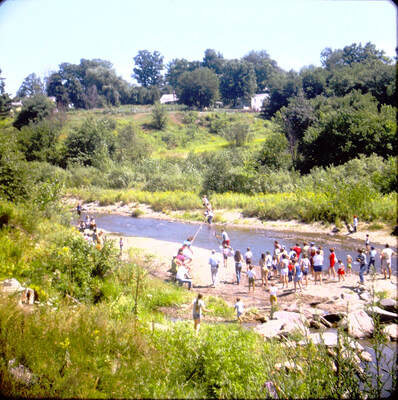 Picture 25 – Tug of War as part of the Old Mill Day celebration August 9, 1975.  This was between the Underhill-Jericho Fire Department, on the far side of the river, and the Richmond Fire Department on the near side.