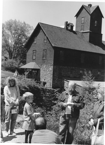 Picture - Gary Irish leading a walking tour of historic Jericho Corners for the historical society May 18, 1991.